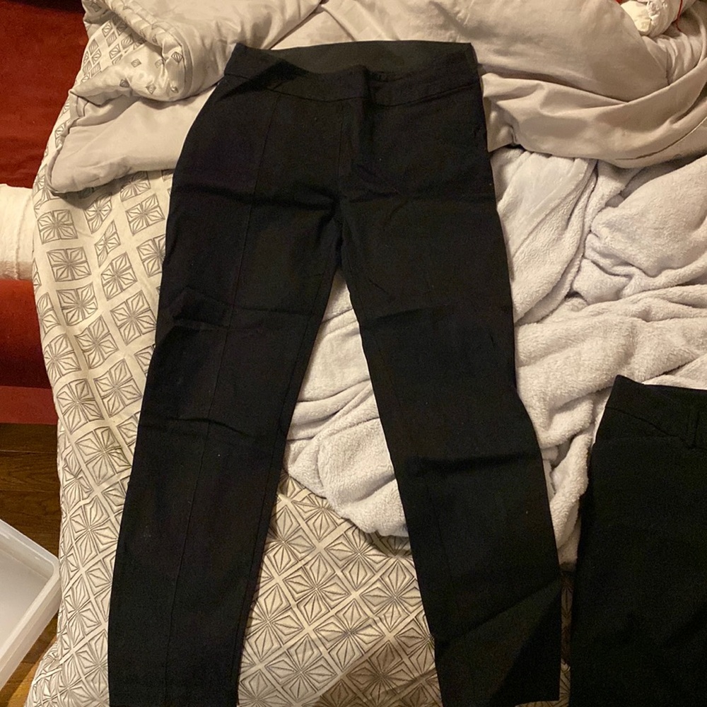 Black ankle-length trousers with elastic waistband